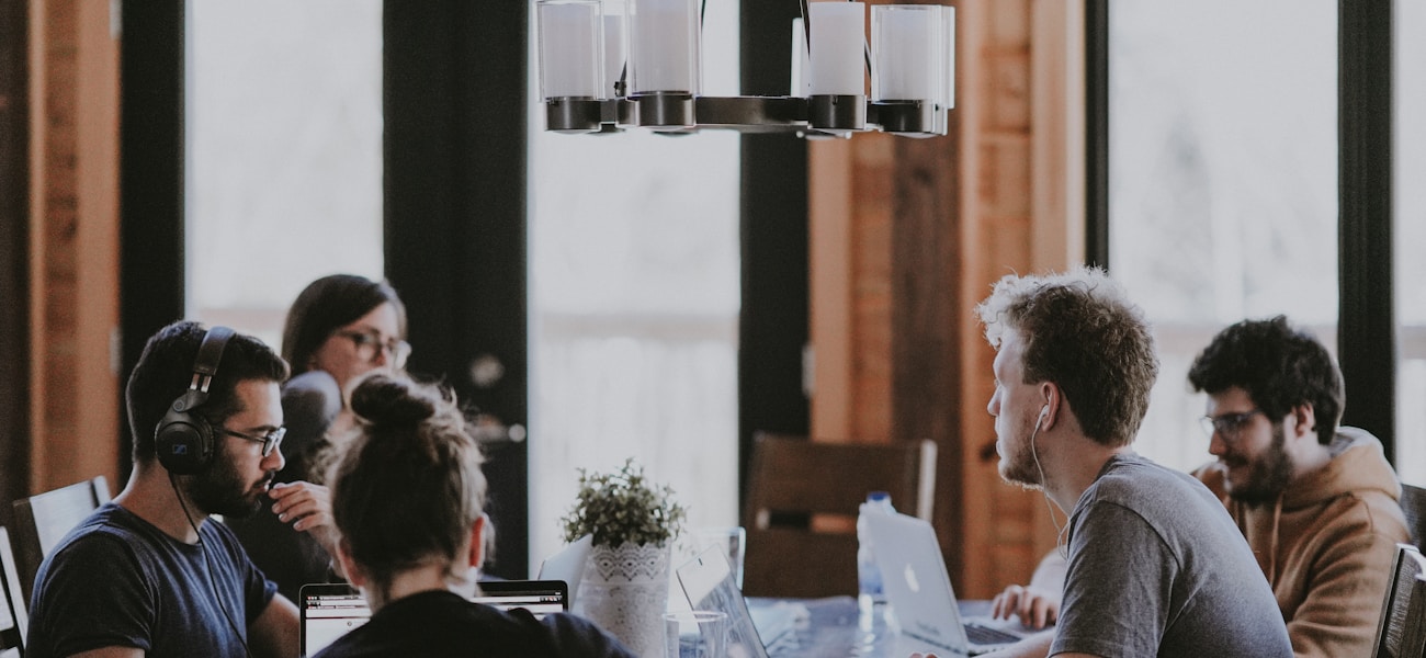 B2B SaaS founder team reviewing product-market fit signals on a dashboard